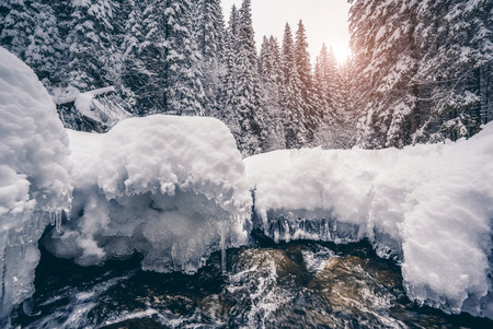Miracle river at sunlight in the morning. Dramatic and picturesque wintry scene. Carpathian, Ukraineの写真素材