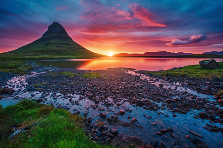 Majestic evening with Kirkjufell volcano the coast of Snaefellsnes peninsula. Popular tourist attraction. Dramatic and picturesque scene. Location place Kirkjufellsfoss, Iceland, Europe. Beauty world.の写真素材