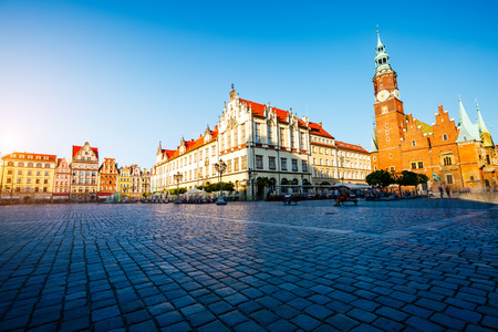 Fantastic view of the ancient homes on a sunny day. Gorgeous picture and picturesque scene. Location famous Market Square in Wroclaw, Poland, Europe. Historical capital of Silesia. Beauty world.の写真素材