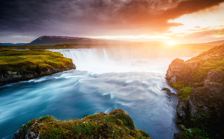 The rapid flow of water powerful Godafoss cascade. Popular tourist attraction. Unusual and gorgeous scene. Location place Bardardalur valley, Skjalfandafljot river, Iceland, Europe.の写真素材