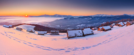 Sunrise in the mountains in winter on a cold morningの写真素材