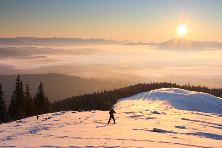 Sunrise in the mountains in winterの写真素材