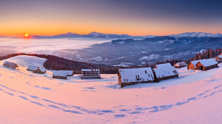 Sunrise in the mountains in winter on a cold morningの写真素材