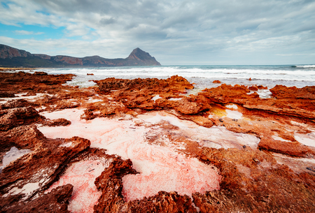 The unique shape of the volcanic beach in sunlight. Picturesque day and gorgeous scene. Outdoor activity. Location place cape San Vito, Monte Cofano Sicilia, Italy Europe. Explore the world's beauty.の写真素材