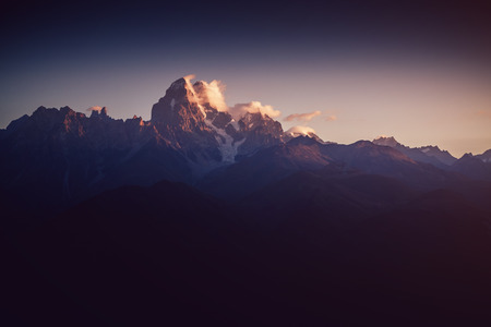 A look at the grand ridges at twilight. Location Upper Svaneti, Georgia country, Europe. Main Caucasian ridge. Scenic image of wild area. Discover the beauty of earth. Impressive adventure wallpapersの写真素材
