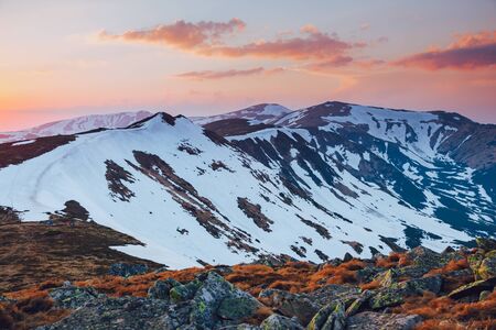 Scenic image of snowy peaks in the sunlight. Location Carpathian national park, Ukraine, Europe. Picture of lifestyle hiking concept. Adventure vacations. Explore the beauty of earth and wildlife.の写真素材