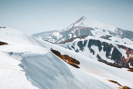 Scenic image of snowy peaks in the sunlight. Location Carpathian national park, Chornogora range,...