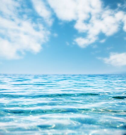Fantastic view of the azure sea. Clear sky on a sunny day with white fluffy clouds. Mediterranean climate. Scenic image of wallpaper. Splendid and gorgeous morning scene. Vibrant seascape background.の写真素材