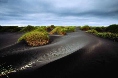 Exotic landscape of the volcanic beach. Location Stokksnes cape, Vestrahorn Iceland, Europe. Scenic image of popular tourist attraction. Unique place. Discover the beauty of earth.の写真素材