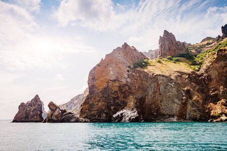 Karadag mountain range in Crimean peninsula, an ancient extinct volcano. Location Kara Dag (Black...
