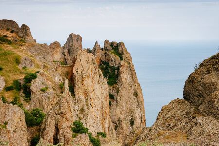 Karadag mountain range in Crimean peninsula, an ancient extinct volcano. Location Kara Dag (Black Mount), coastal town of Koktebel. Unique place on earth. Explore the world's beauty and wildlife.の写真素材
