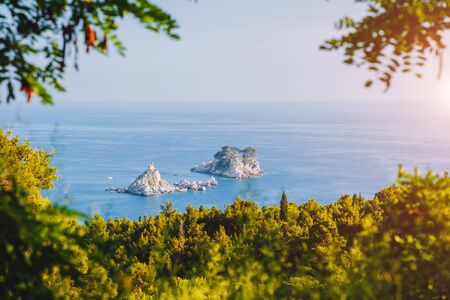 Gorgeous view of Adriatic sea with small islet Sveta Nedelja. Location Petrovac town, Montenegro, Balkans, Europe.の写真素材