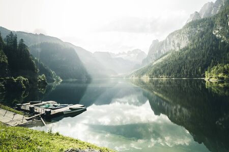 Stunning image of great alpine lake Vorderer Gosausee. Salzkammergut is a famous resort area located in the Gosau Valley in Upper Austria. Dachstein glacier.の写真素材