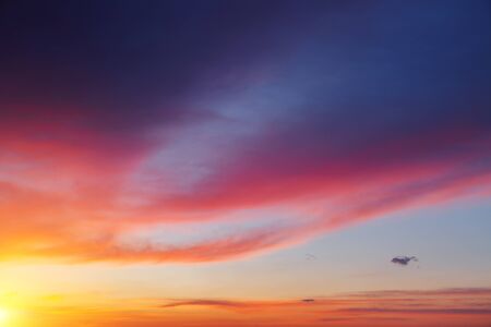 Attractive red vivid clouds illuminated by the beams of the sun. Scenic image of textured sky. Ecology concept - climate change in the environment. Spectacular wallpaper. Discover the beauty of earth.の写真素材