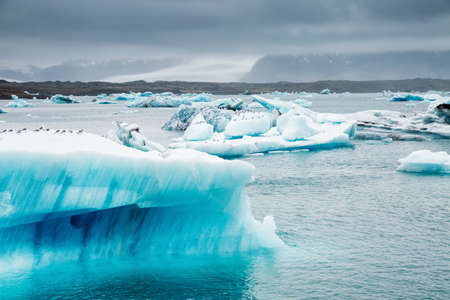 Exotic scene of Jokulsarlon lagoon, large pieces of iceberg drifts in the ocean. Location famous place Vatnajokull national park, island Iceland, Europe. Climate change. Explore the beauty of world.の写真素材