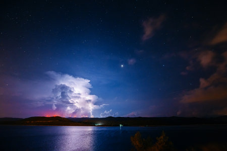 An ominous storm clouds are highlighted by lightning. Location place coast of Croatia, Adriatic Sea,...