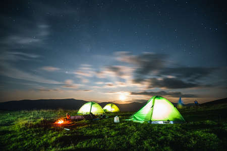 Scenic image of the night sky above the campsite. Location place of Carpathian mountains, Ukraine, Europe. Astrophotography. Breathtaking natural wallpaper background. Discover the beauty of earth.の写真素材