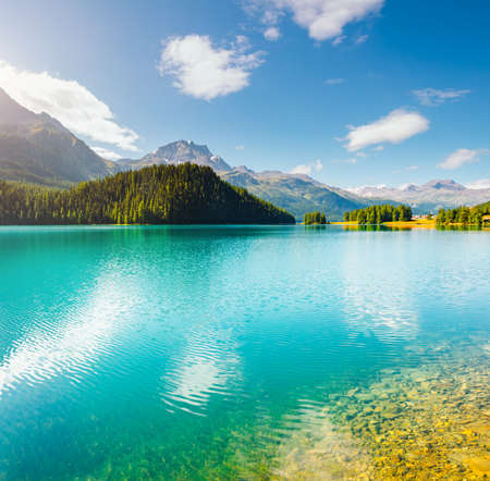Exotic alpine lake Champfer in beautiful summer day. Location place Silvaplana village, Swiss alps, district Maloja, Europe. Scenic image of popular tourist destination. Discover the beauty of earth.の写真素材