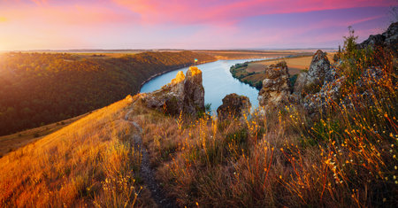 Panoramic view of meander of the Dniester River from a bird's eye view. Location place Dnister canyon of Ukraine, Europe. World landmarks. Picturesque photo wallpaper. Discover the beauty of earth.の写真素材