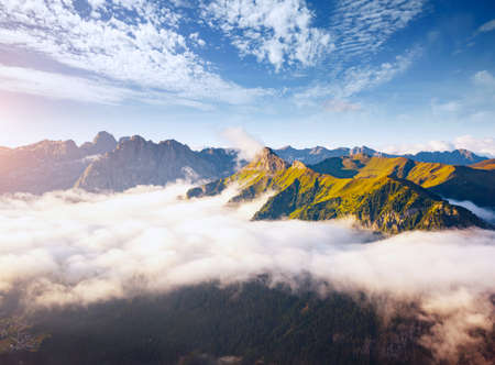 Morning foggy view of the Val di Fassa valley in Dolomite mountains. Location place famous Canazei resort, passo Sella, Dolomiti, Trentino Alto Adige, Italy, Europe. Discover the beauty of world.の写真素材