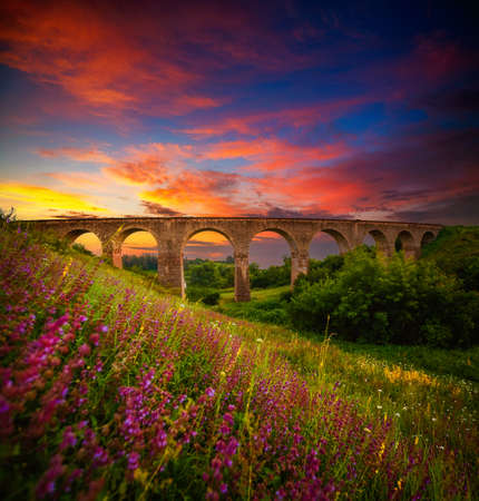 Fantastic view to beautiful old railway viaduct. Location village Plebanivka, Ukraine, Europe. Scenic image of most popular travel destination. Famous historical place. Discover the beauty of earth.の写真素材