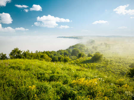 Fantastic day with green hills and cultivated fields. Picturesque summer scene. Artistic wallpaper. Location place country of Ukraine, Europe. Most beautiful wallpaper. Discover the beauty of world.の写真素材