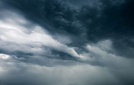 Tropical ominous clouds in front of the hurricane. Awesome photo of the texture of storm clouds. Adverse weather conditions. Climate change. Wallpaper force of nature. Discover the beauty of earth.の写真素材