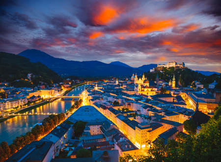 Salzburg city shining in the lights at night. Location place Festung Hohensalzburg, Salzburger Land, Austria, Europe. Photo of popular tourist attraction of the world. Discover the beauty of earth.の写真素材