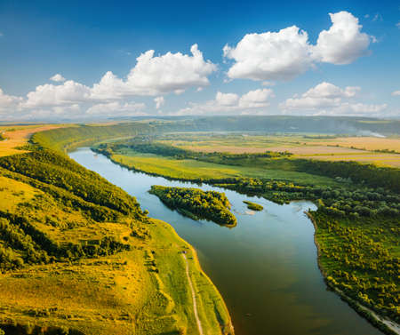Attractive aerial top view of the sinuous Dniester River. Location place Dnister canyon of Ukraine, Europe. Aerial photography, drone shot. Picturesque photo wallpaper. Discover the beauty of earth.の写真素材