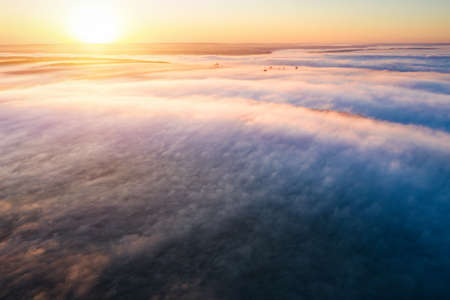Majestic misty view of the picturesque countryside with the rays of morning light. Location place Dniester canyon of Ukraine, Europe. Aerial photography, drone shot. Photo wallpaper. Beauty of earth.の写真素材