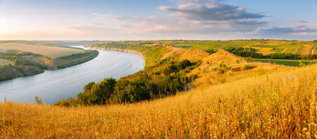 Breathtaking top view of the Dniester River and green meadows. Location place Dnister canyon of Ukraine, Europe. Vibrant photo wallpaper. Gorgeous summer image. Discover the beauty of earth.の写真素材