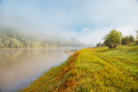 A thick fog covered the Dniester River in the morning. Location place Dnister canyon of Ukraine, Europe. picturesque photo wallpaper. Splendid nature photography. Discover the beauty of earth.の写真素材