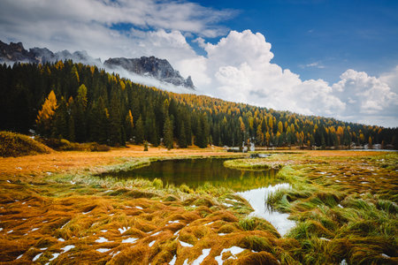 Dramatic image of autumn lake in National Park Tre Cime di Lavaredo. Location place Misurina lake, Auronzo, Dolomiti alps, South Tyrol, Italy, Europe. photo wallpapers. Discover the beauty of earth.の写真素材