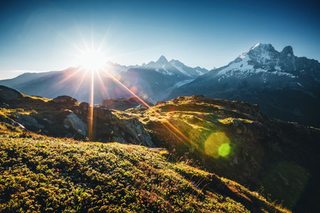 A gorgeous panoramic view of a grand mountain range on a sunny day. Location Chamonix resort, Graian Alps, France, Europe. Scenic image of exotic places. photo wallpaper. Discover the beauty of earth.の写真素材