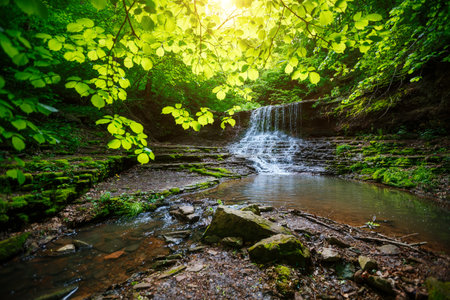 Gorgeous view of the unique waterfall on a sunny day. Location place Rusyliv Falls, Carpathian, Ukraine, Europe. Vibrant photo wallpaper. picturesque nature photography. Discover the beauty of earth.の写真素材