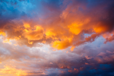 An epic sunset with colorful clouds lit by the sun. Photo of textured sky. Scenic image of dramatic light in summer weather. breathtaking natural wallpaper background. Discover the beauty of earth.の写真素材