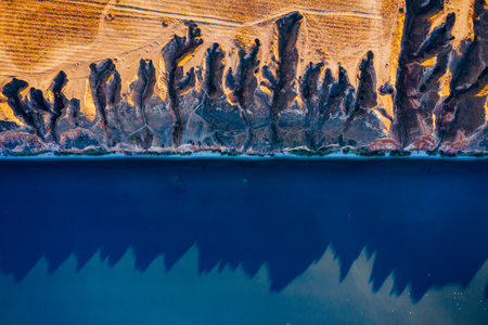 Drone shot on the sandy hills of the Dnieper Bay on a sunny day. Location place canyon Stanislav, Ukraine, Europe. Aerial photography. Image from a bird's eye view. Discover the beauty of earth.の写真素材