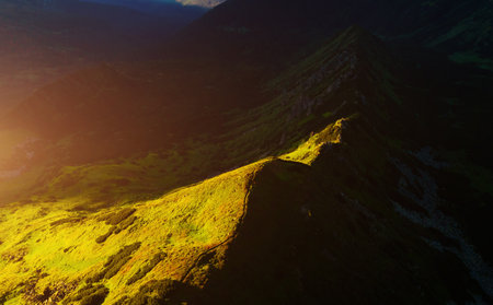 The majestic mountain range is illuminated by the sun. Location place Carpathian mountains, Ukraine, Europe. Vibrant photo wallpaper. Scenic image of the alpine valley. Discover the beauty of earth.の写真素材