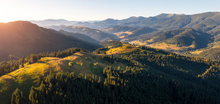 Gorgeous panorama of green hills in a mountain area on a sunny day. Location place Carpathian mountains, Ukraine, Europe. Perfect photo wallpaper. Tranquil sunshine vibe. Discover the beauty of earth.の写真素材