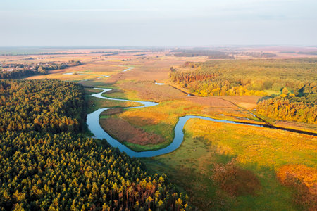 Majestic view from a drone flying over the winding river. Location place Polissya region, Ukraine, Europe. Bird's eye view, drone photography.の写真素材