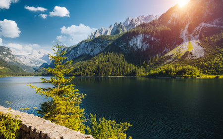 Splendid scene of alpine lake Vorderer Gosausee. Location place of famous resort Salzkammergut, Gosau Valley, Upper Austria, Europe. Dachstein glacier. Photo wallpaper Discover the beauty of earth.の写真素材