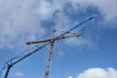 Construction site with tower crane for lifting building materials