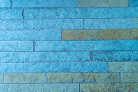 Background of old vintage dark blue brick wall old school styleの写真素材