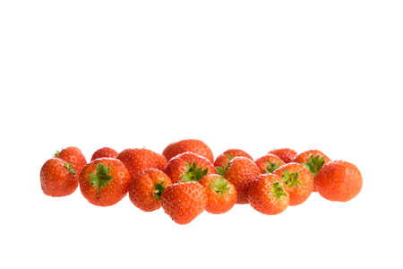 Fresh strawberries lying in a group isolated on a white backgroundの写真素材