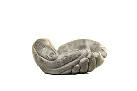 Bowl of concrete hands in praying position isolated in white backgroundの写真素材