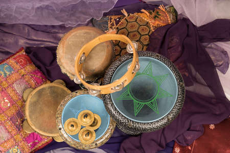 Top view of musical instruments of a bellydance percussiongroup with darbuka's, tambourines and zillsの写真素材