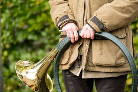 French horn band held in hands by a hunter on Saint Hubertus Day, 05/11/2017, De Moer, The Netherlandsの写真素材