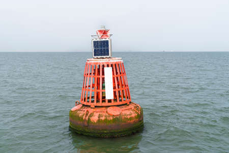 An Electric bollard light or buoy on the open sea in the esuary of the Thames, England, UKの写真素材