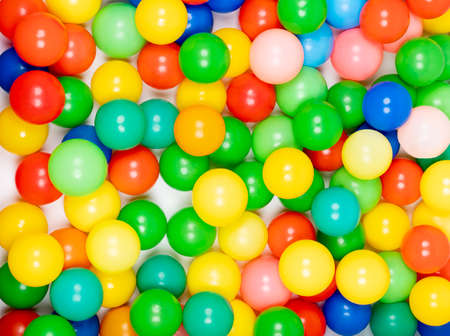 Top view of many bright colorful balls in ball pool at indoors playgroundの写真素材