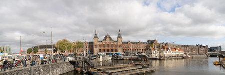 20181018 - Amsterdam - The Netherlands: Morning blue sky in the front of European style building, Amsterdam central stationのeditorial素材